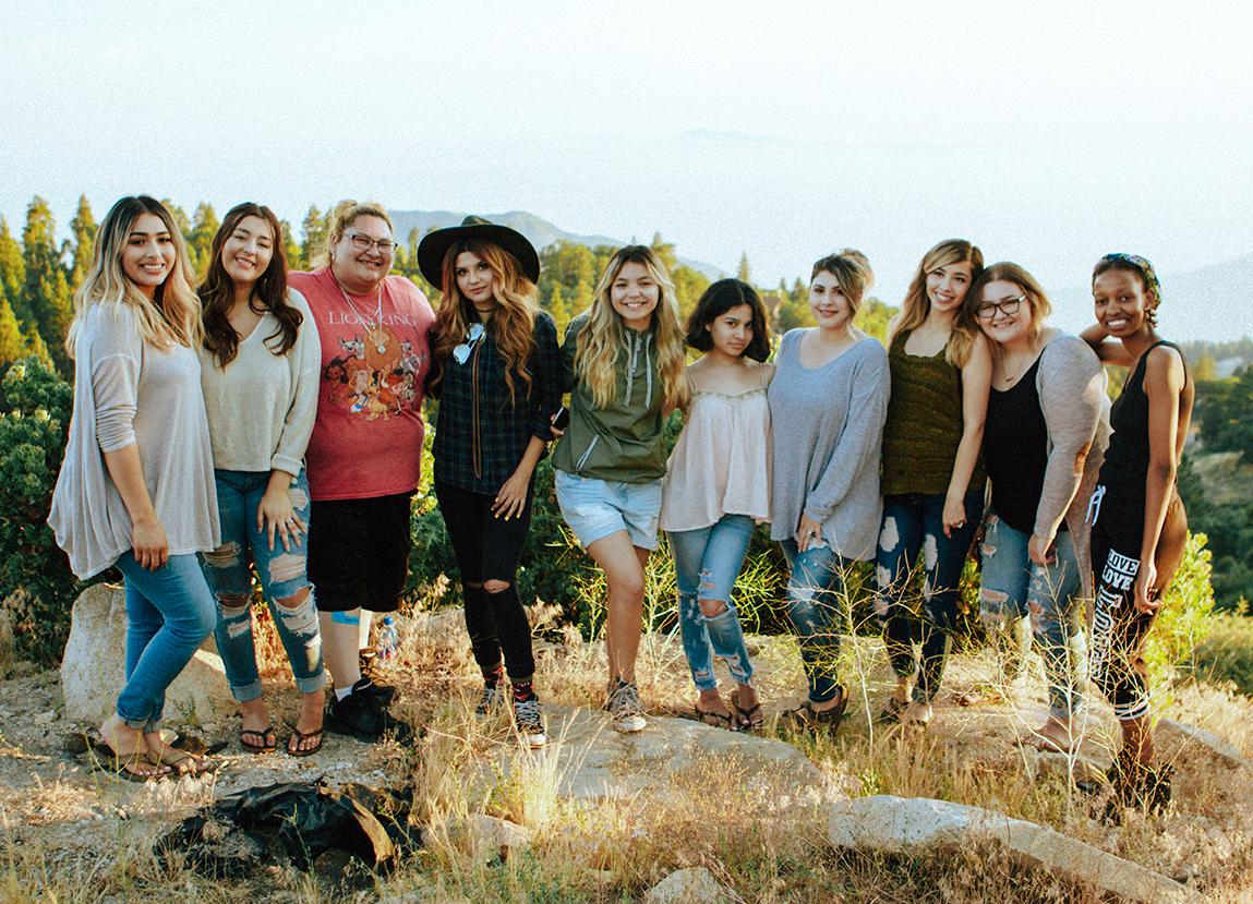 Group of happy people at an outdoor retreat.